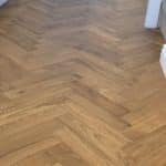 Engineered herringbone golden oak close up