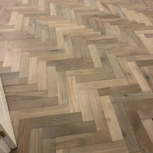 grey herringbone flooring close up