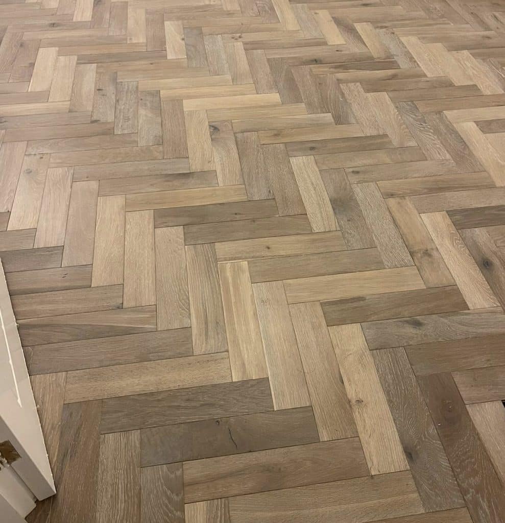 grey herringbone flooring close up