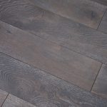 Black with white grain flooring close up