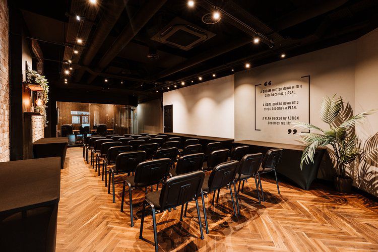 Trending dark 'Double Smoked Engineered Herringbone' fitted in a corporate conference room